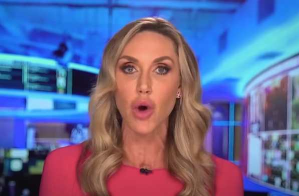 Lara Trump speaking into a camera with her lips wide open.