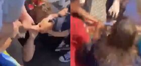 Mob laughs as they viciously stomp 12-year-old kid who wore a rainbow flag to a picnic