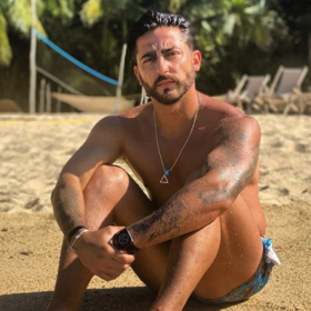 Mexican reality star Luis Caballero addresses rumors that his girlfriend caught him DMing with men