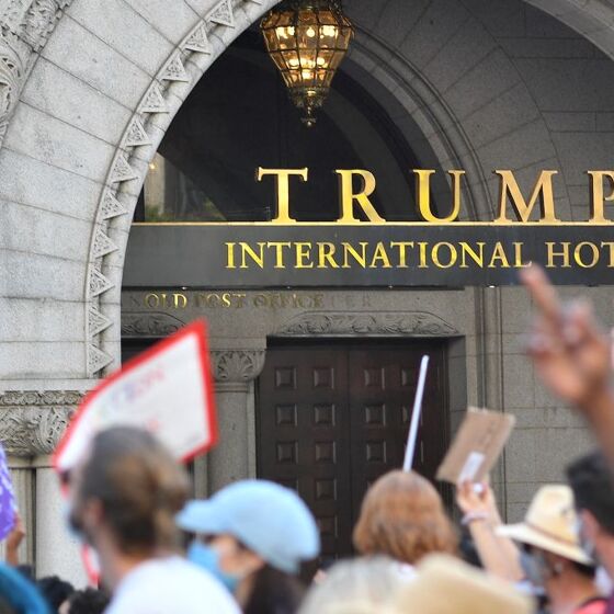 Onlookers cheer as Trump’s failing D.C. hotel closes for good and tacky gold signage gets ripped down