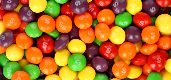 Skittles’ Twitter account likes pics of OnlyFans star covered in rainbows–and nothing else
