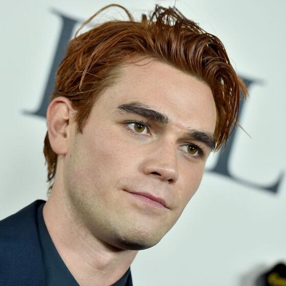 KJ Apa leaves little to the imagination chasing after a dog in his underwear