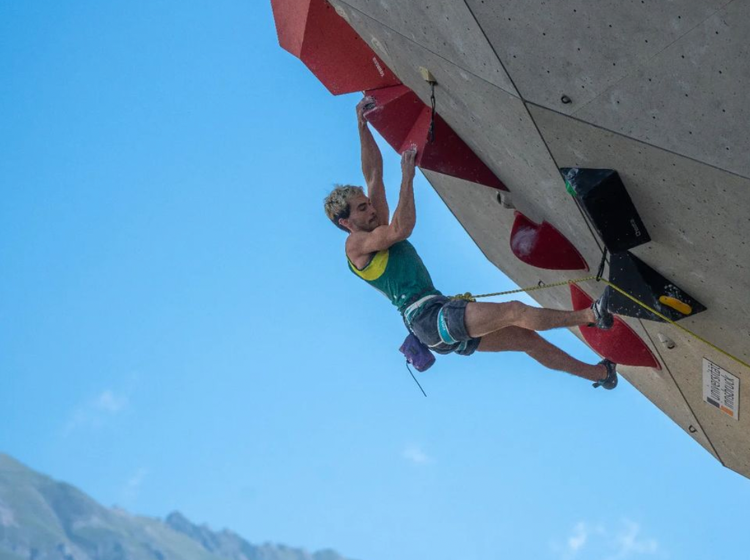 Hunky champion sports climber shares his empowering coming out story while scaling new heights