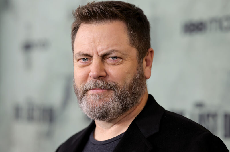 Nick Offerman in a black t-shirt and blazer.