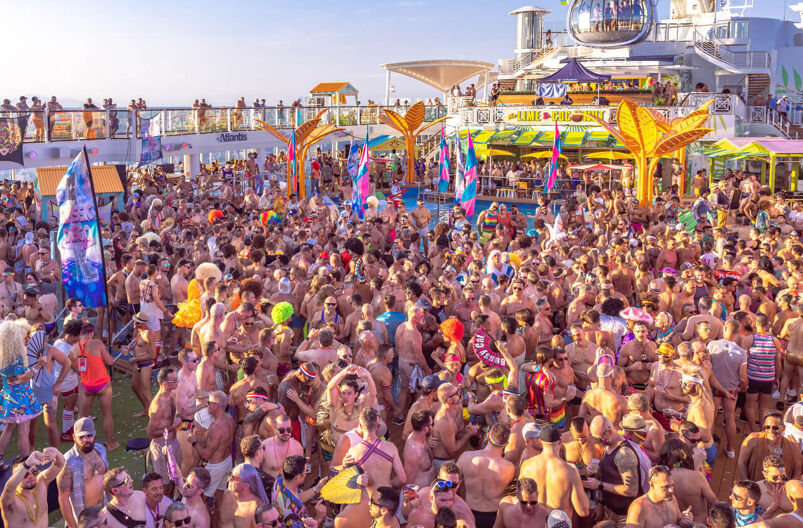A sea of shirtless guests party on an Atlantis Events cruise.