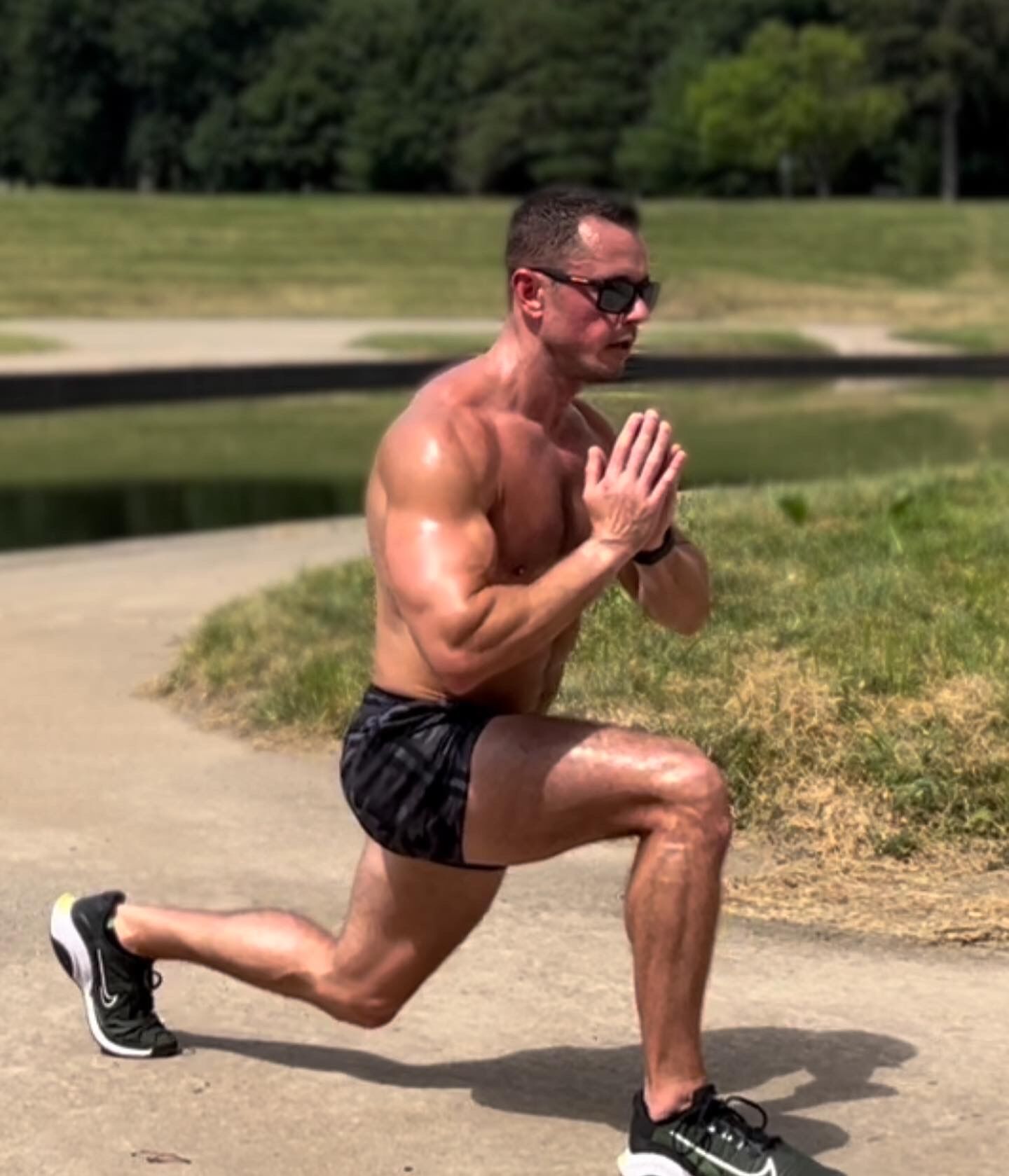 Hunky fitness trainer demonstrates what exercises will lead to