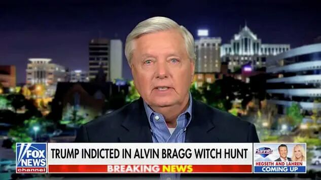 Lindsey Graham in a blue shirt looking teary-eyed on Fox News
