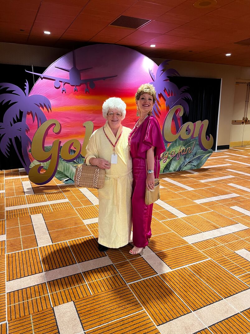 two people in golden girls costumes at golden con portraying sophia and blanche