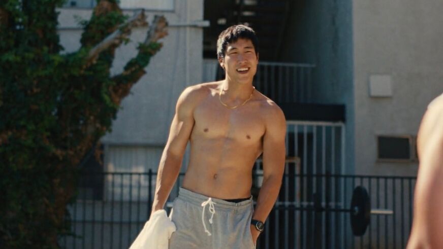 Young Mazino in 'Beef,' shirtless and wearing grey sweatpants poolside