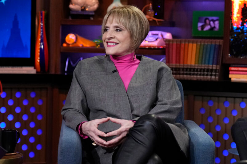 Patti LuPone wears a pink turtleneck and grey blazer on What What Happens Live