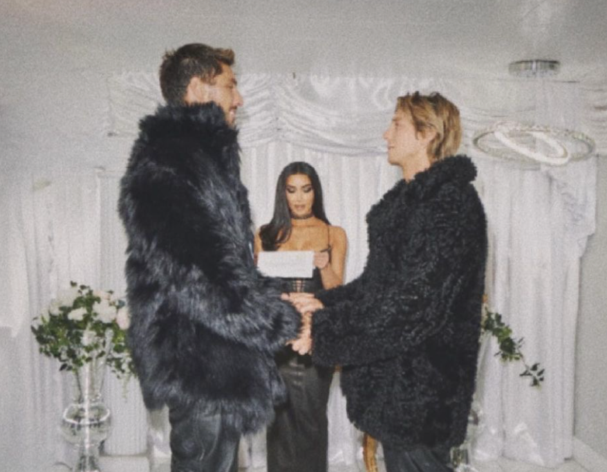 Chris Appleton and Lukas Gage exchanging vows while Kim Kardashian officiates