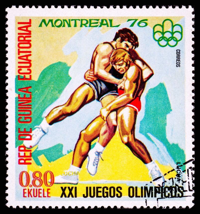 A postage stamp from Guinea showing Wrestling at XXI Olympic Games in Montreal