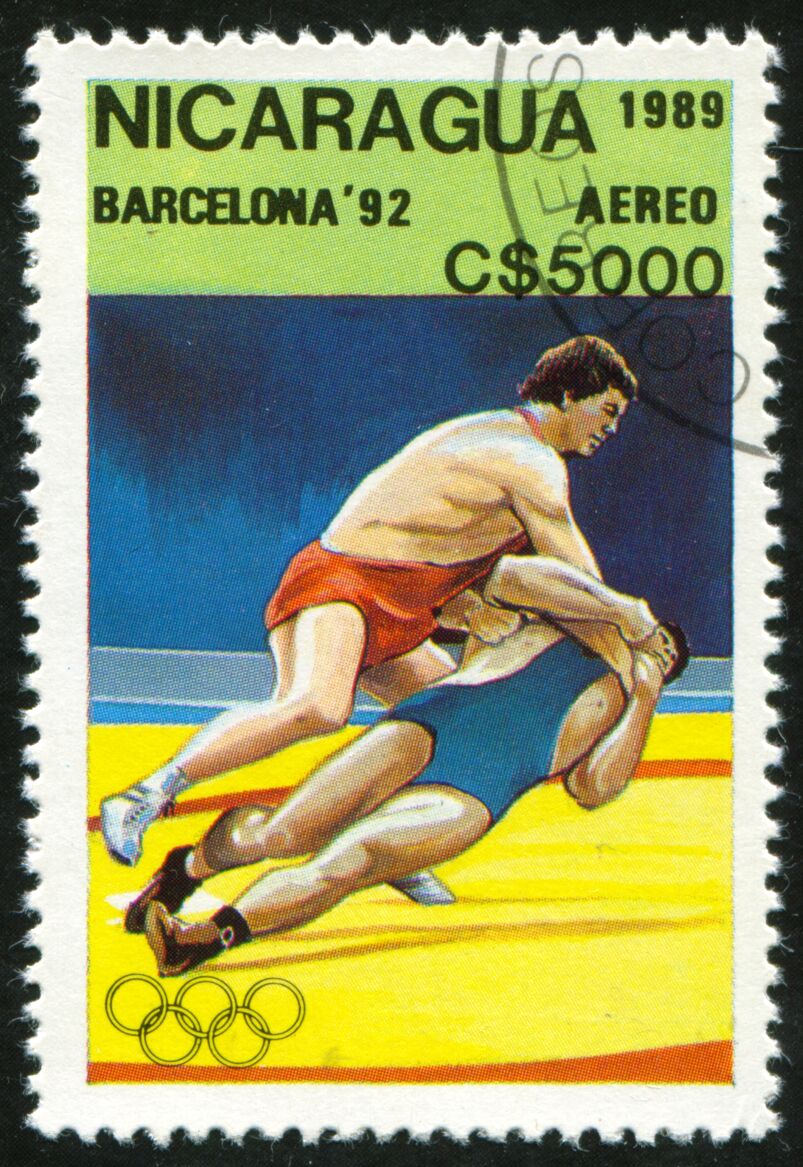 A stamp printed in Nicaragua shows Wrestling, Olympic Games 1992