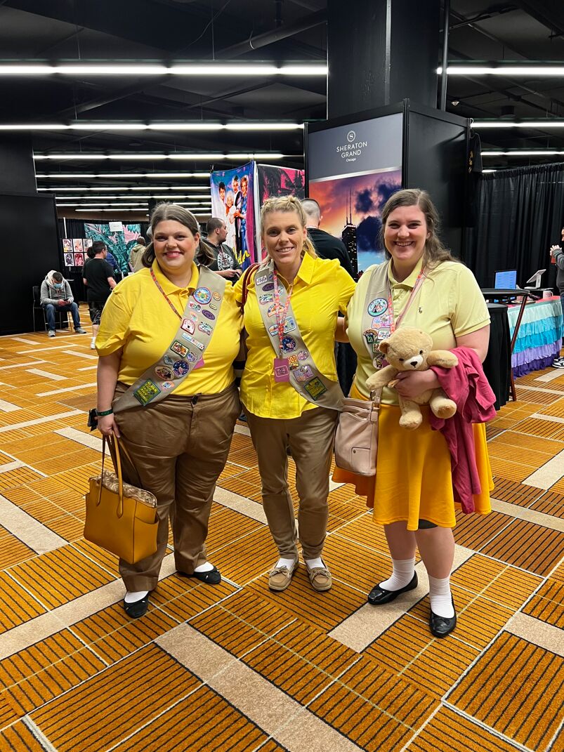 three people in golden girls costumes portraying sunshine cadets