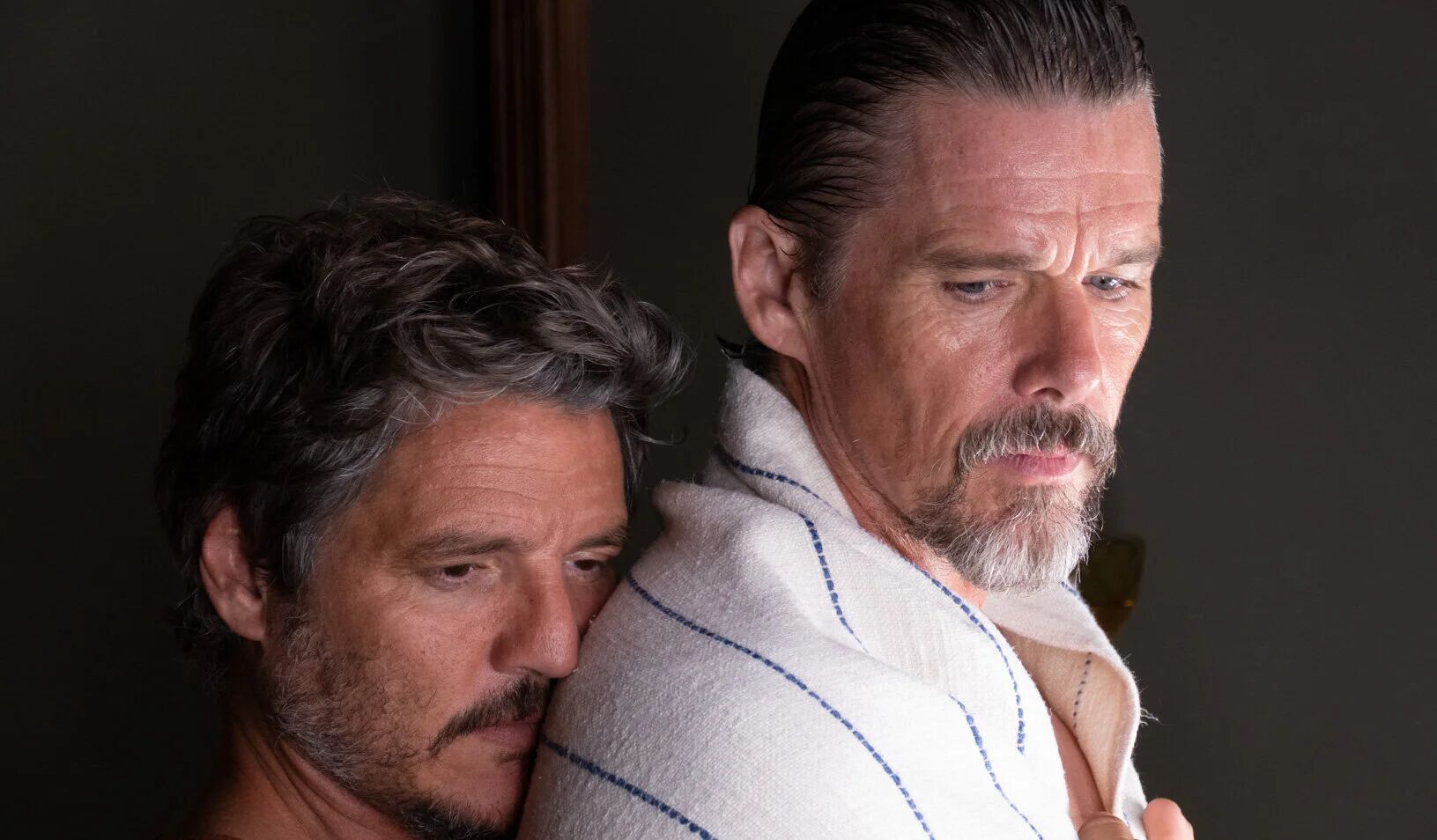 Pedro Pascal and EThan Hawke embrace in a still from 'A Strange Way Of Life'