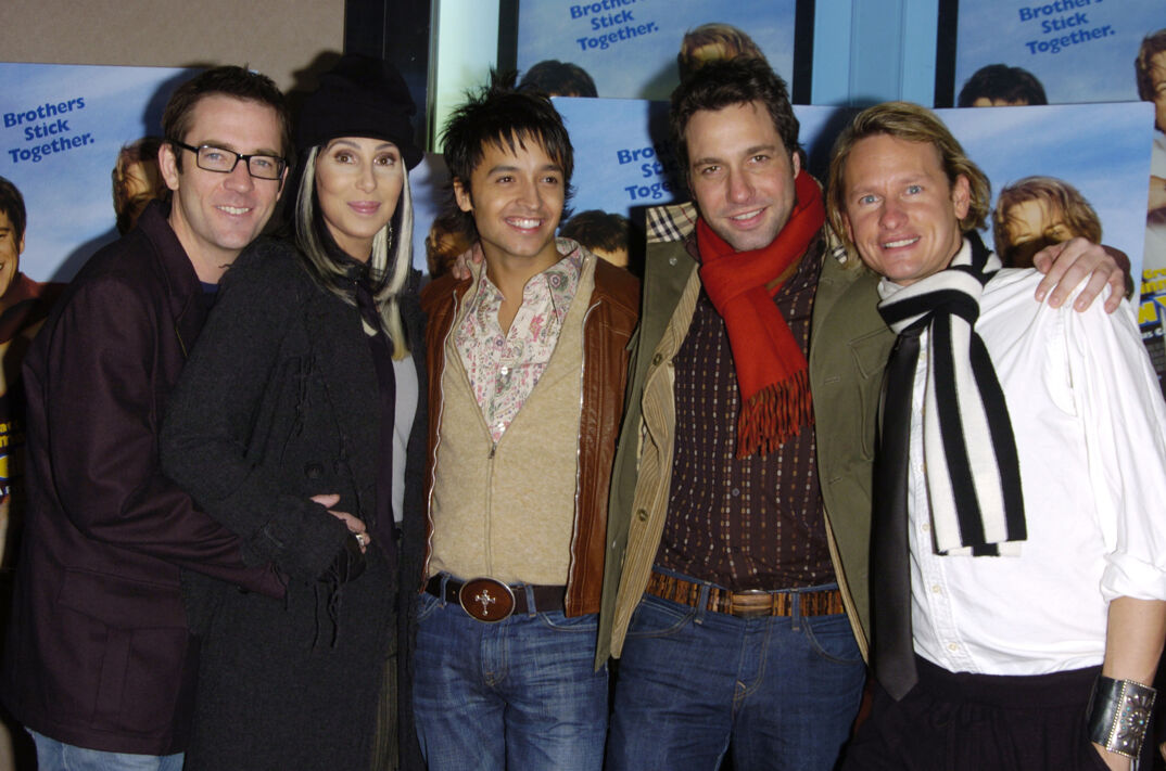 Ted Allen poses with his arms around Cher alongside Jai Rodriguez, Thom Filicia, and Carson Kressley on the red carpet at the 'Stuck on You' premiere.
