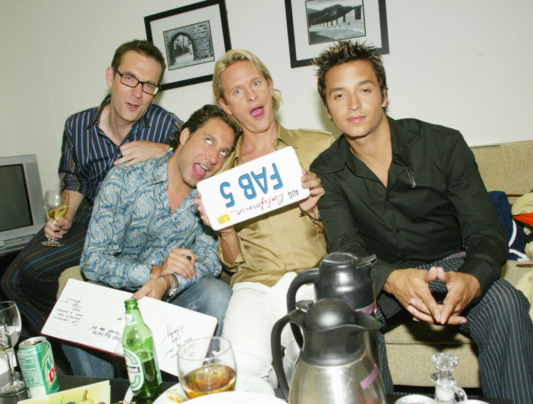 Ted Allen, Thom Filicia, Carson Kressley, and Jai Rodriguez sit on a couch making funny faces with a "Fab 5" sign backstage at 'The Tonight Show With Jay Leno.'