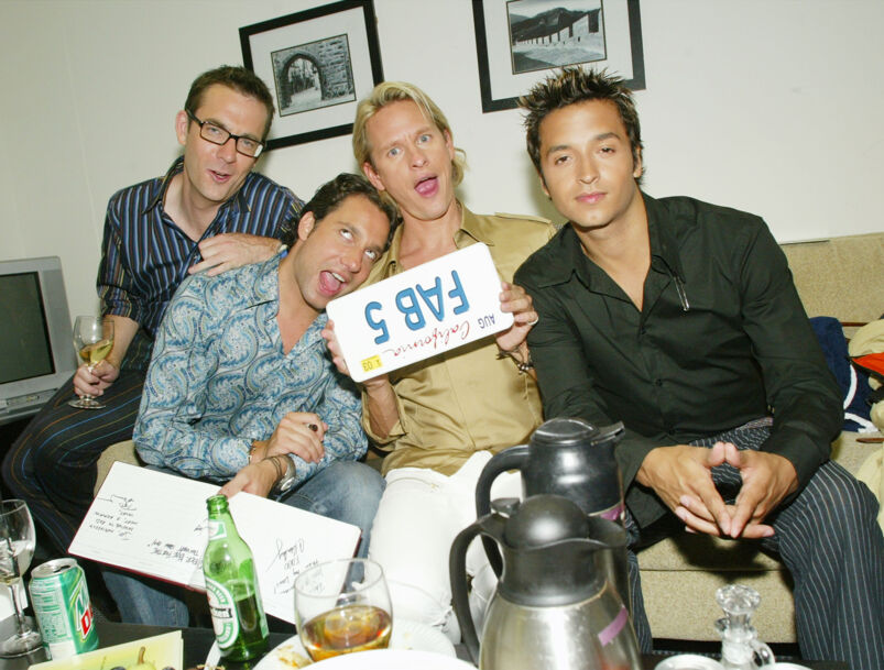 Ted Allen, Thom Filicia, Carson Kressley, and Jai Rodriguez sit on a couch making funny faces with a "Fab 5" sign backstage at 'The Tonight Show With Jay Leno.'