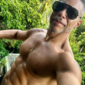 Wilson Cruz is living his best “island boy” life with a week’s worth of hot & sweaty shirtless pics