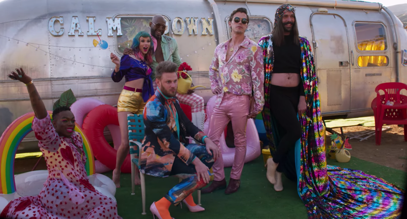 Todrick Hall, Taylor Swift, Karamo Brown, Bobby Berk, Antoni Porowski, and Jonathan Van Ness pose in flamboyant outfits in front of an RV on the set of the "You Need to Calm Down" music video.