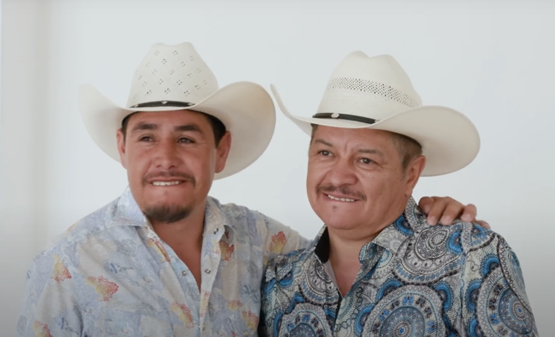 Two Mexican cowboys dressed in traditional attire.