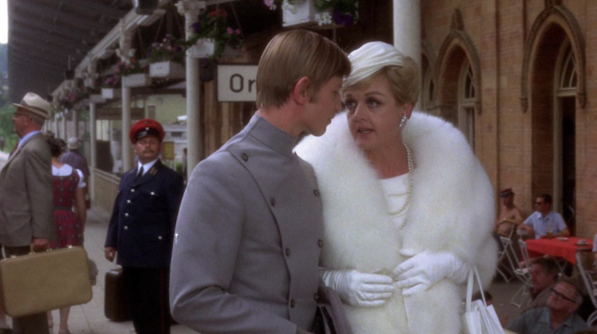Michael York and Angela Lansbury in a white coat  in a still from 'Something For Everyone'