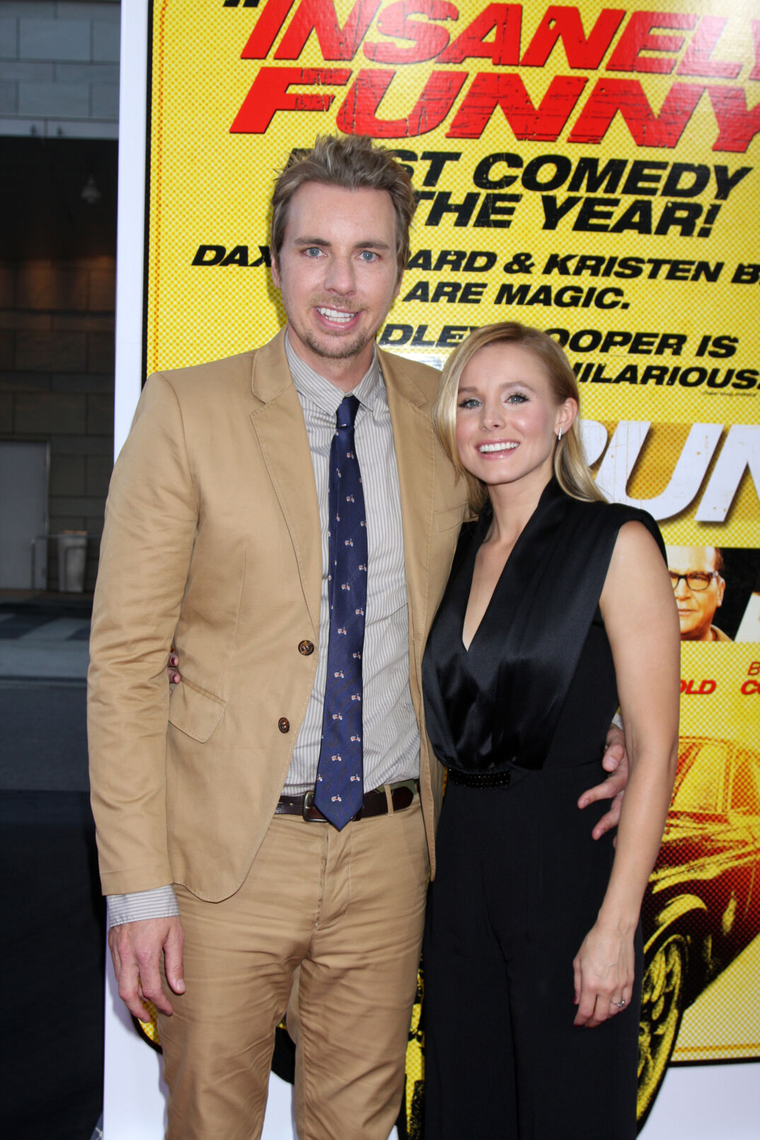Dax Shepard and Kristen Bell smiling on the red carpet for 'Hit and Run.'