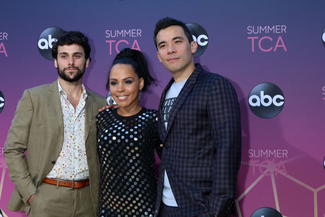 'How to Get Away with Murder' stars Jack Falahee, Amirah Vann, and Conrad Ricamora pose on the red carpet.