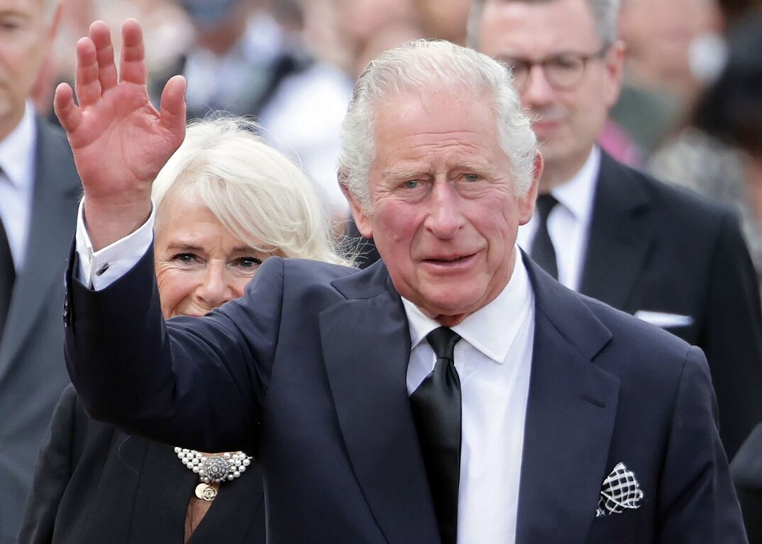 King Charles waving his hand