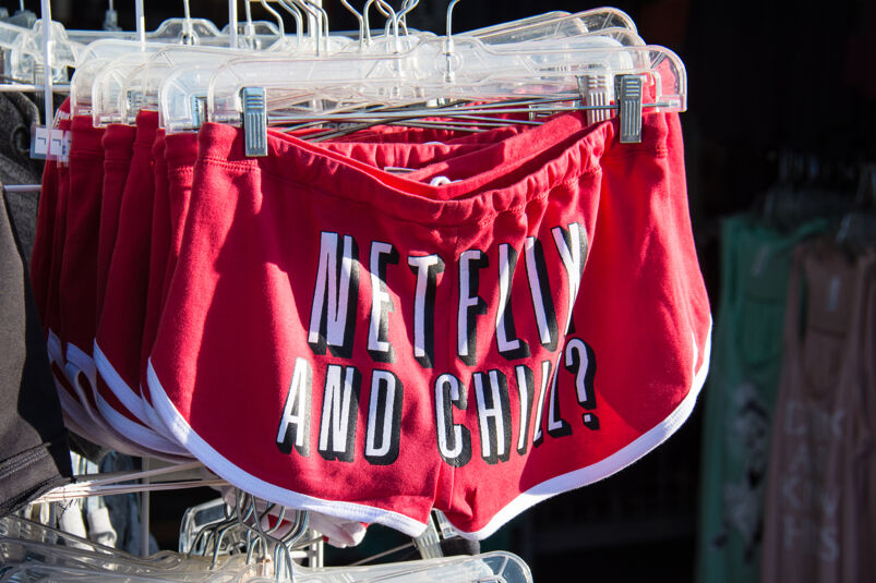 Shorts sold at a gift shop with the slang phrase "Netflix and Chill" printed on the butt