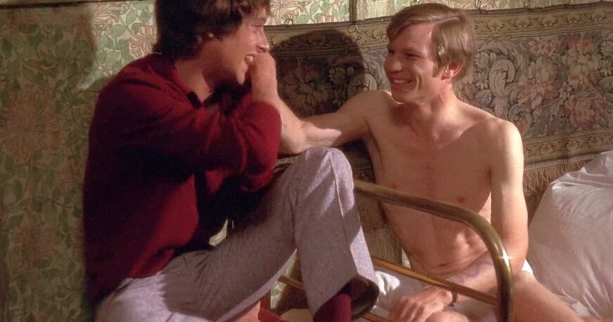 Michael York is shirtless and flirts with a man in a still from 'Something For Everyone'