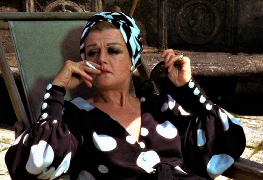 Angela Lansbury lounges and smokes in a still from 'Something For Everyone'