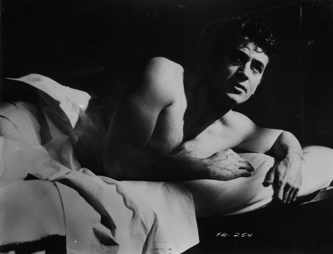Rock Hudson awakens in a scene from the film 'A Farewell To Arms', 1957.