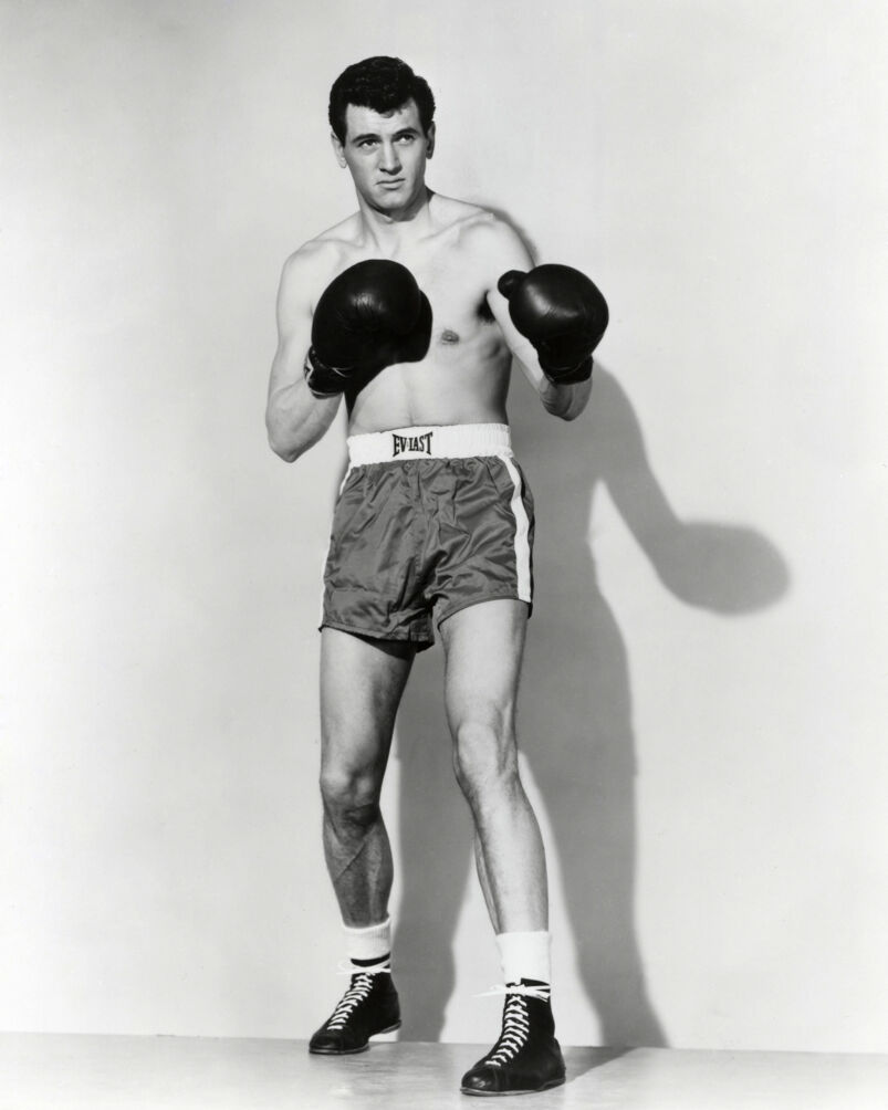 A promotional portrait of American actor Rock Hudson as boxer Tommy 'Speed' O'Keefe (aka Kosco) in 'Iron Man.'
