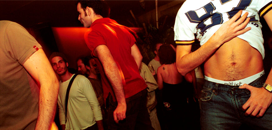 A scene at a gay bar in the 1990s