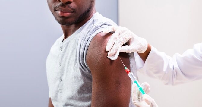A man receives a vaccine shot