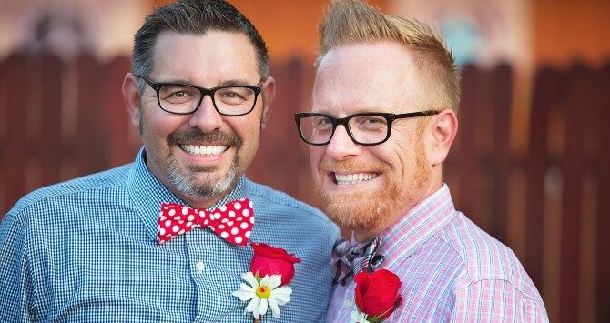 A same-sex couple at a wedding