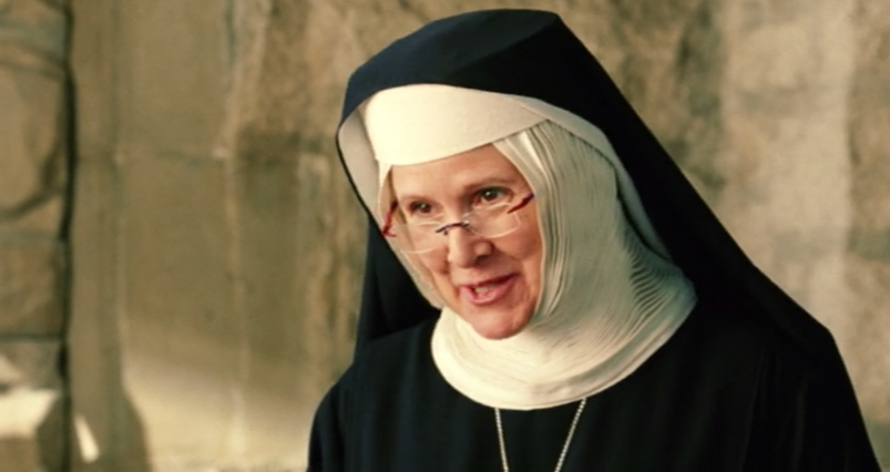 Carrie Fisher, wearing a nun's habit and glasses, smiles in a scene from 'Charlie's Angels: Full Throttle.'