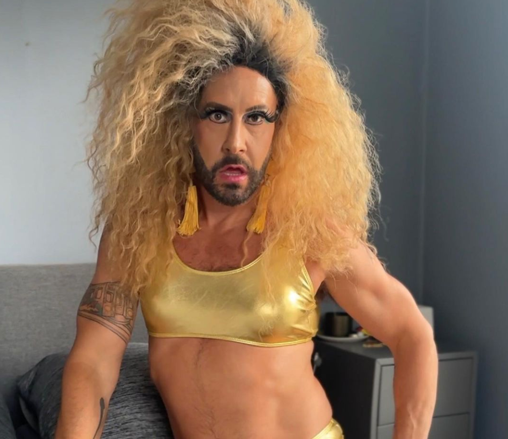 NY drag queen Levonia in a gold bikini top