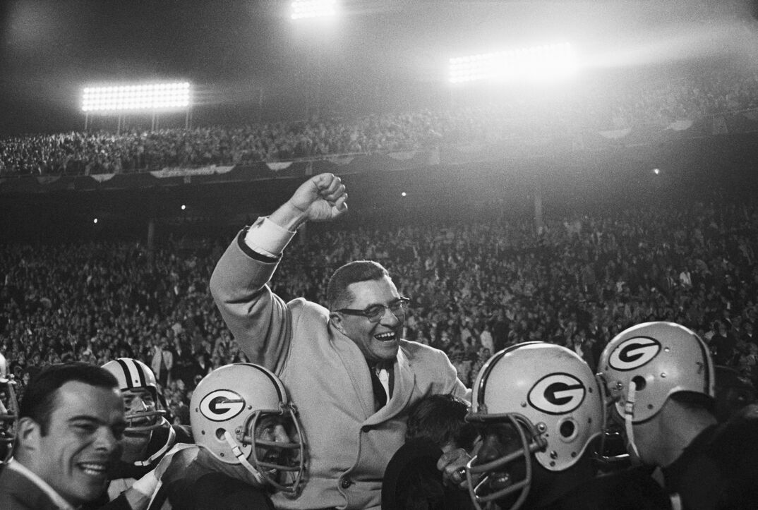 Vince Lombardi being carried by Packers players after a big win.