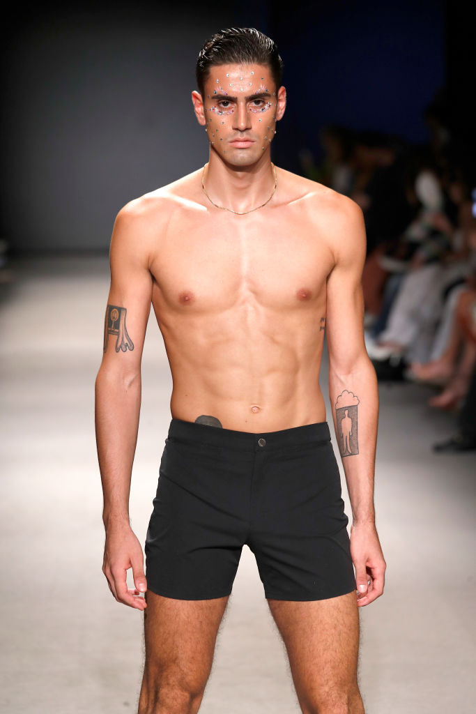 Male model in black swimsuit