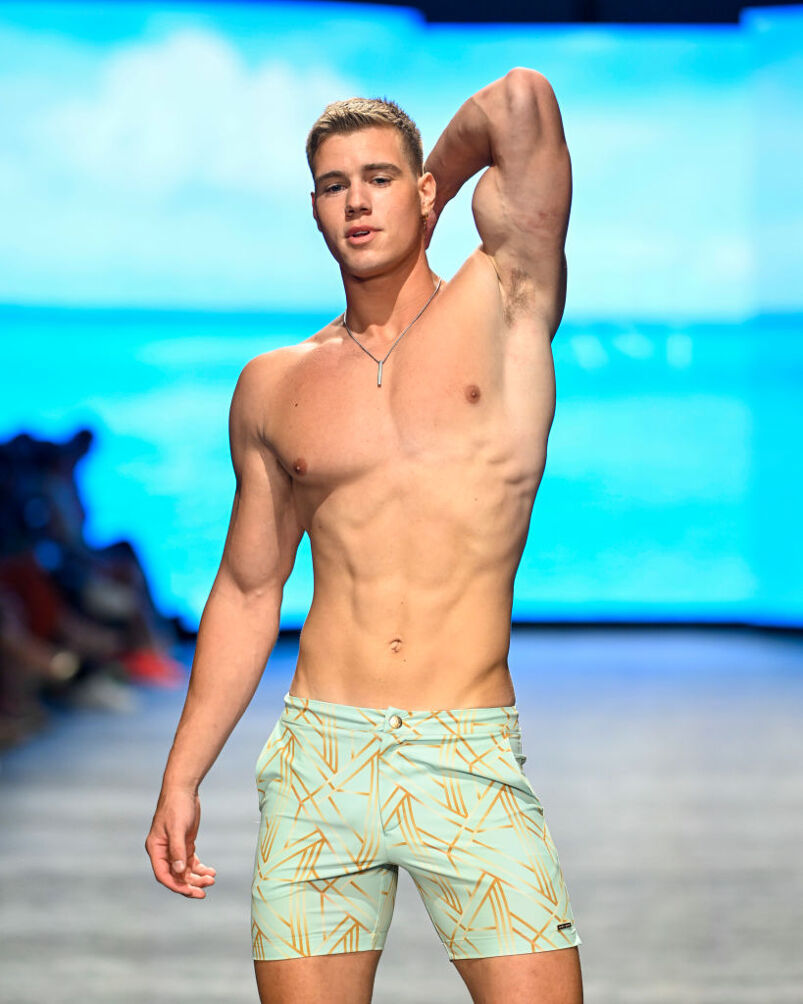 Shirtless male model in board shorts
