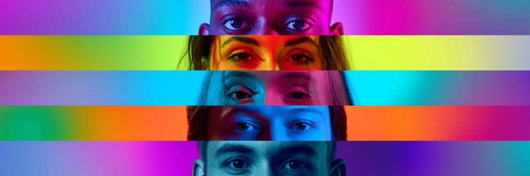 A rainbow-colored collage of the eyes of a diverse group of people's faces