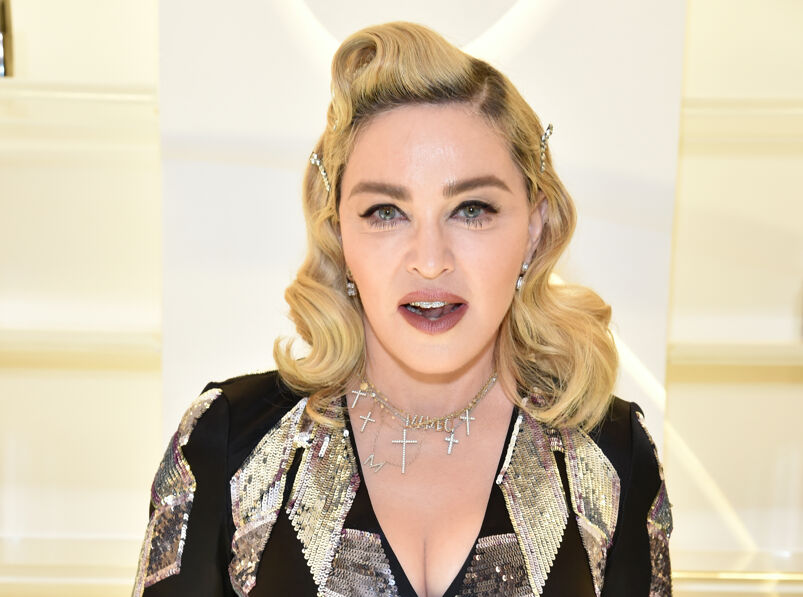 Madonna in a gold and black ensemble