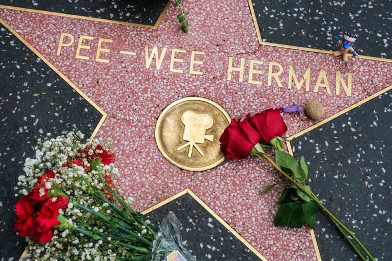 Flowers are placed at the star of Pee Wee Herman on the Hollywood Walk of Fame, Monday, July. 31, 2023, in Los Angeles
