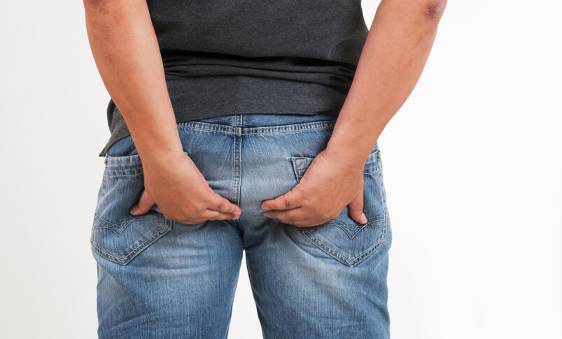 Penetration Can Cause Cancer Featured Photo - A Man Wearing A Grey Shirt and Blue Jeans Holding His Bottom