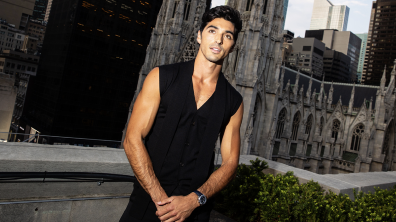 Taylor Zakhar Perez wearing a black vest on a New York City rooftop