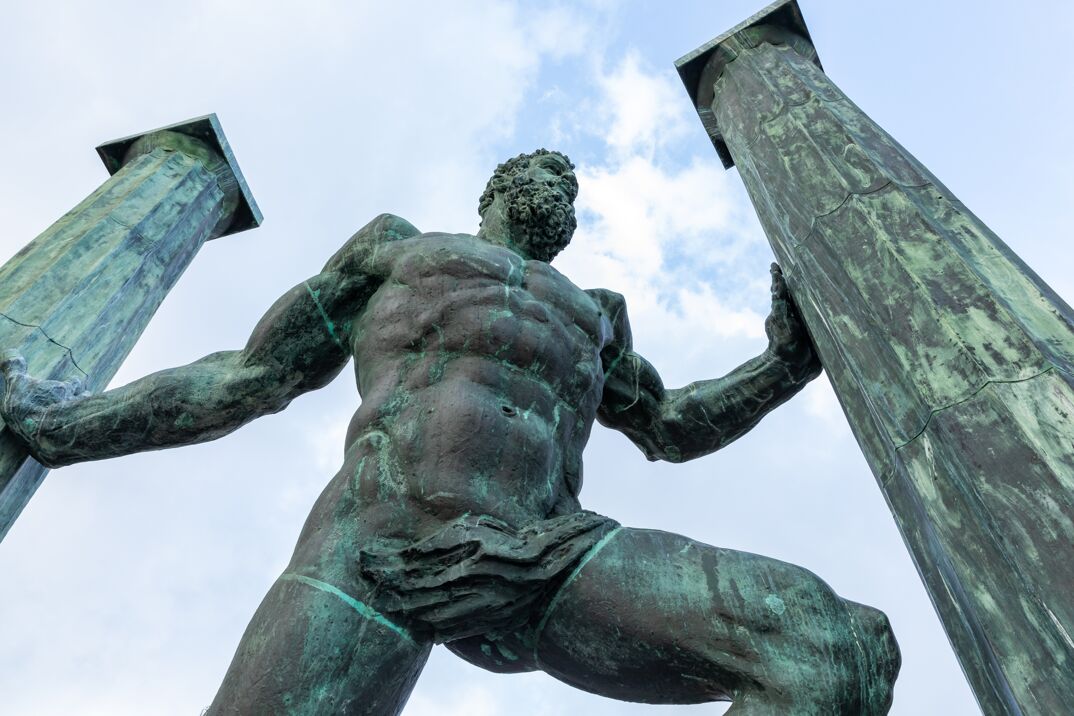 A sculpture of a greek god. 
