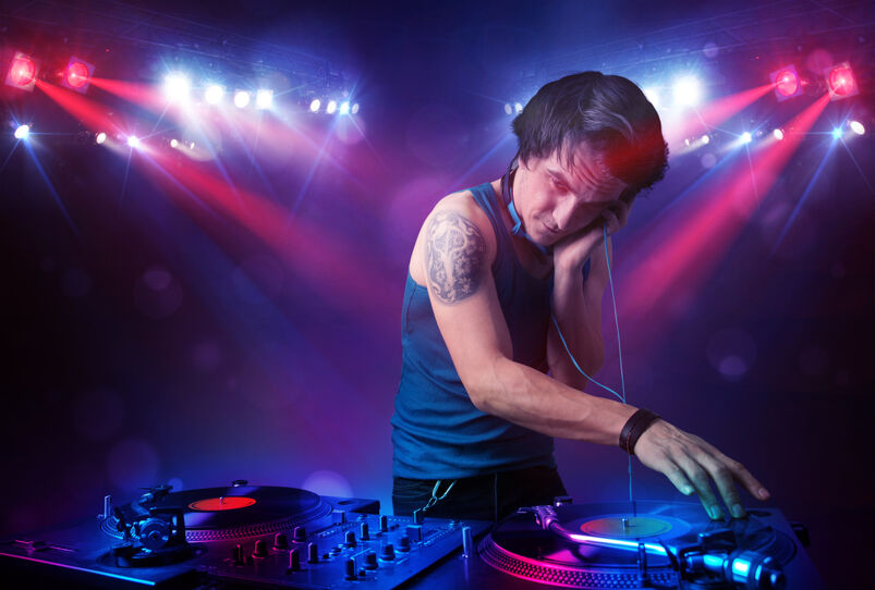 10 best songs about gay sex: A handsome DJ spinning records at a club
