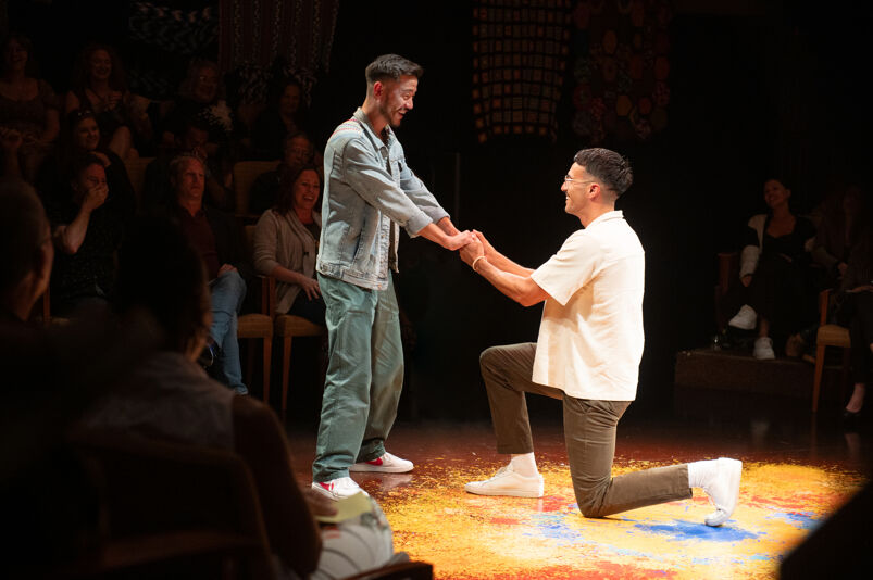 Daniel K. Isaac with an audience member in 'You Will Get Sick.' Photo by Isaak Berliner